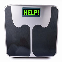Weighing scale saying HELP!