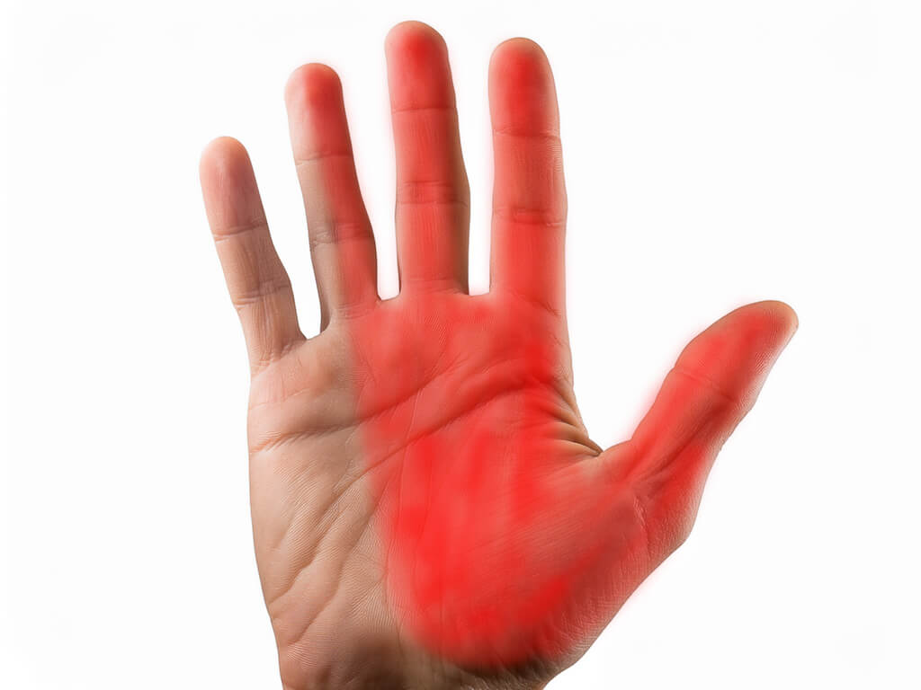 Hand shaded over carpal tunnel syndrome numbness