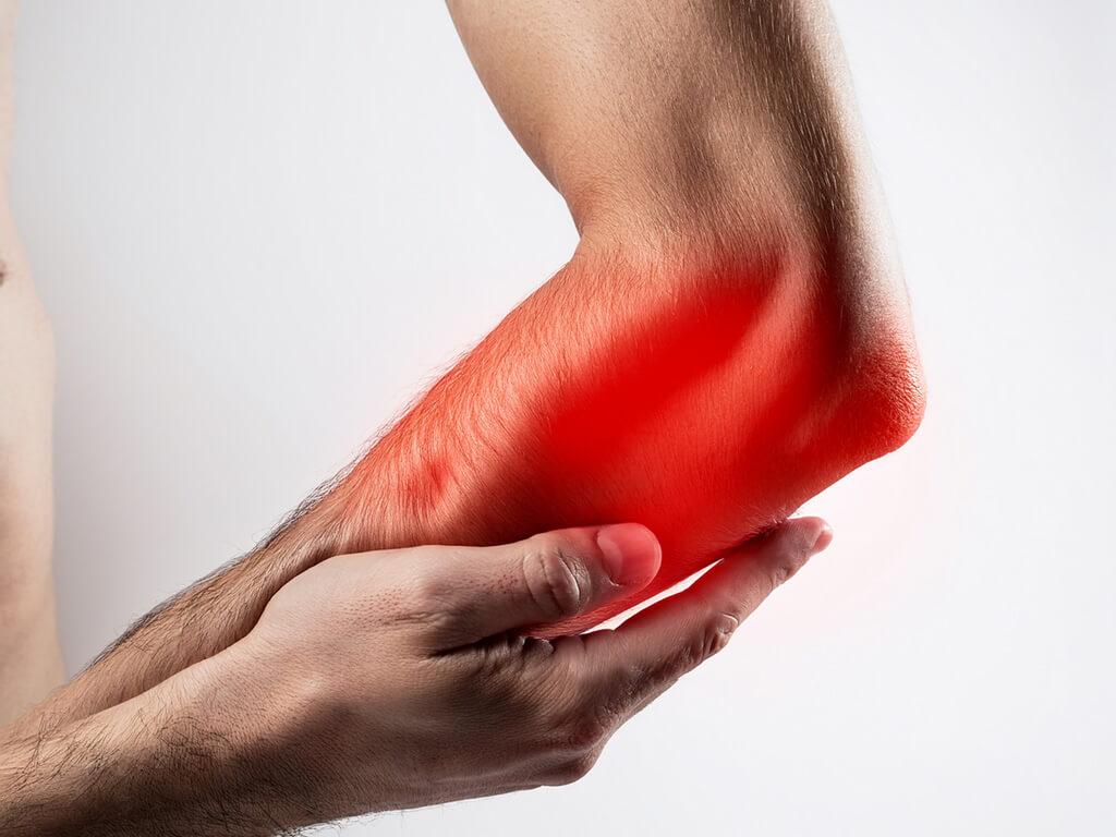 man holding painful elbow